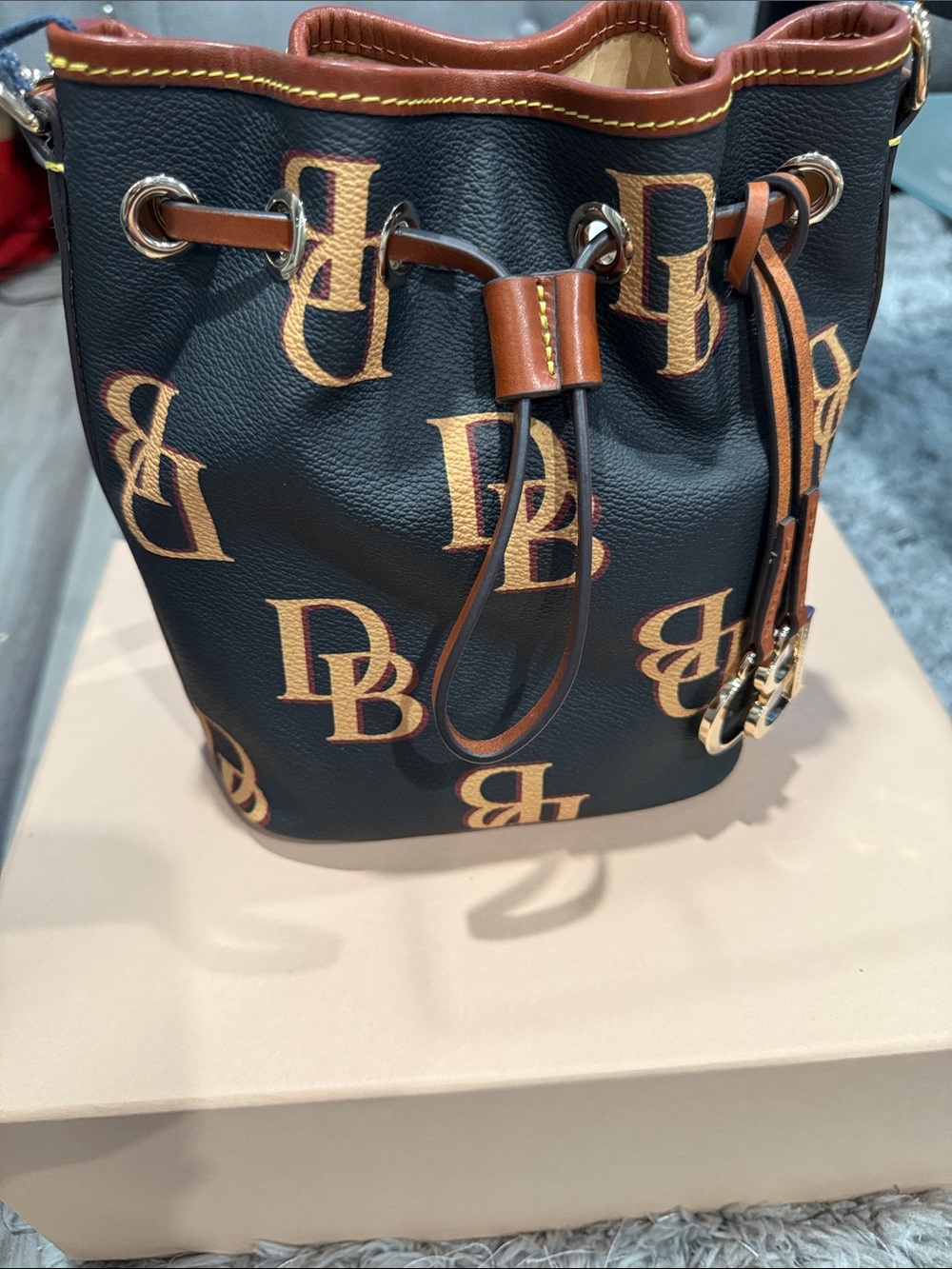 Dooney & Bourke Black Bucket Crossbody with Tan Monogram